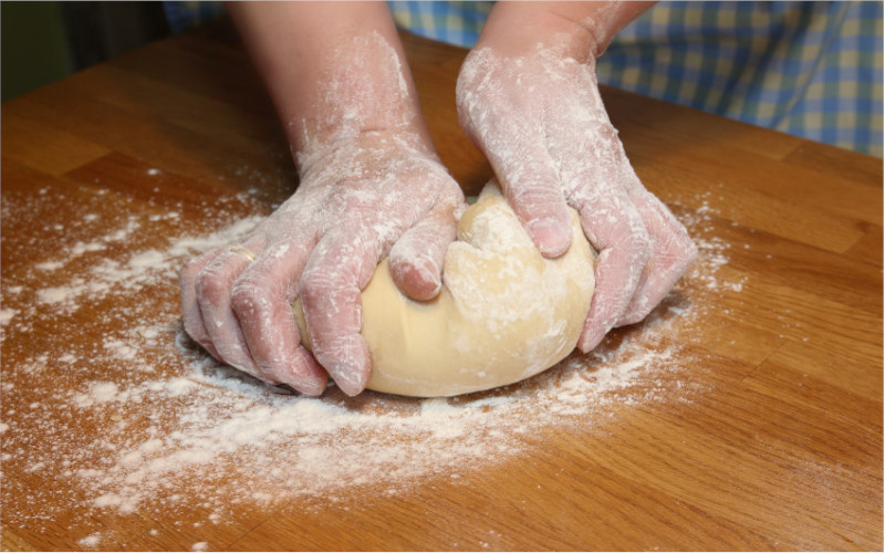 flour and hands in the dough